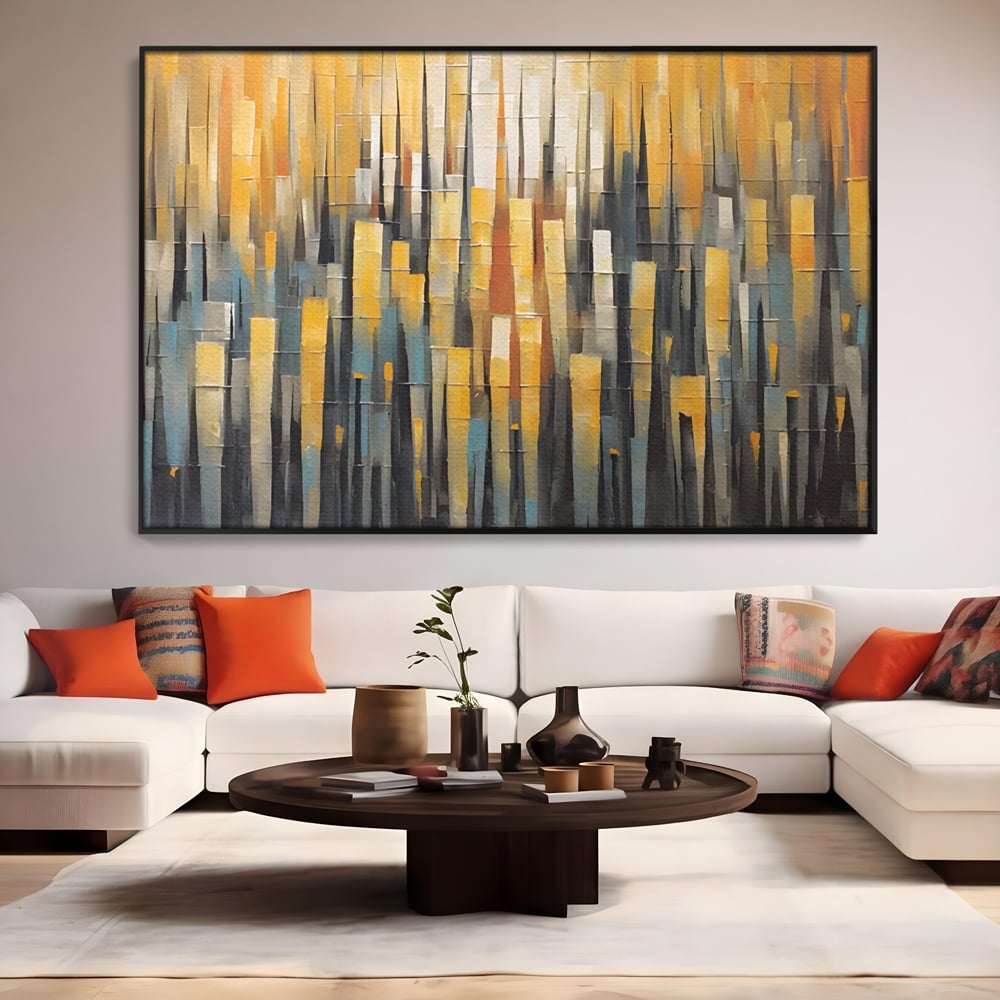 Tablou canvas cu pictura abstracta cu dungi verticale aurii, in rama de aluminiu negru, pe perete intr-un living
